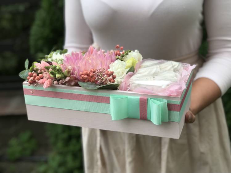 Flowers in a box with sweets 