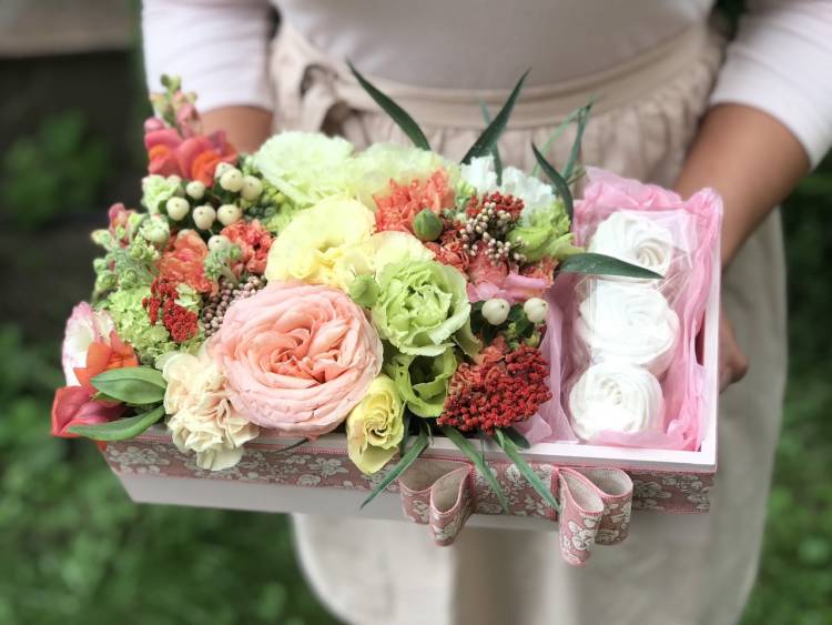 Flowers in a box with sweets 